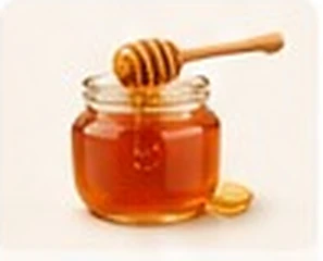 Pote de mel com colher de mel